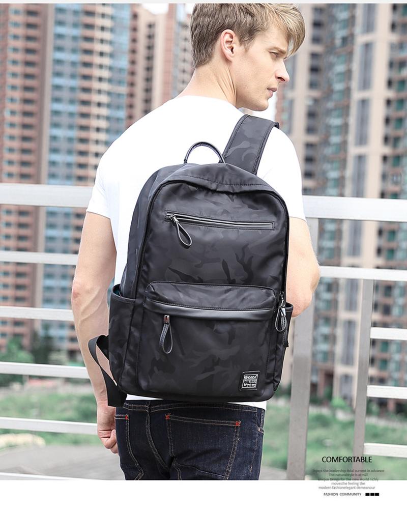 卡卡2017夏季新款韩版双肩包男 酷黑迷彩学生背包 休闲防水书包