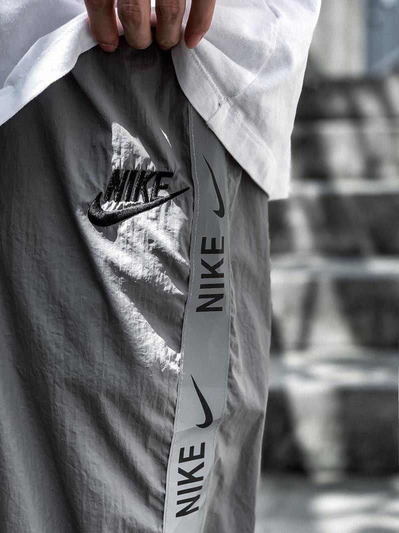 耐克/Nike男生反光织带串标拼接长裤2020新款网红同款情侣款初秋季节必备单品夜跑聚会女生